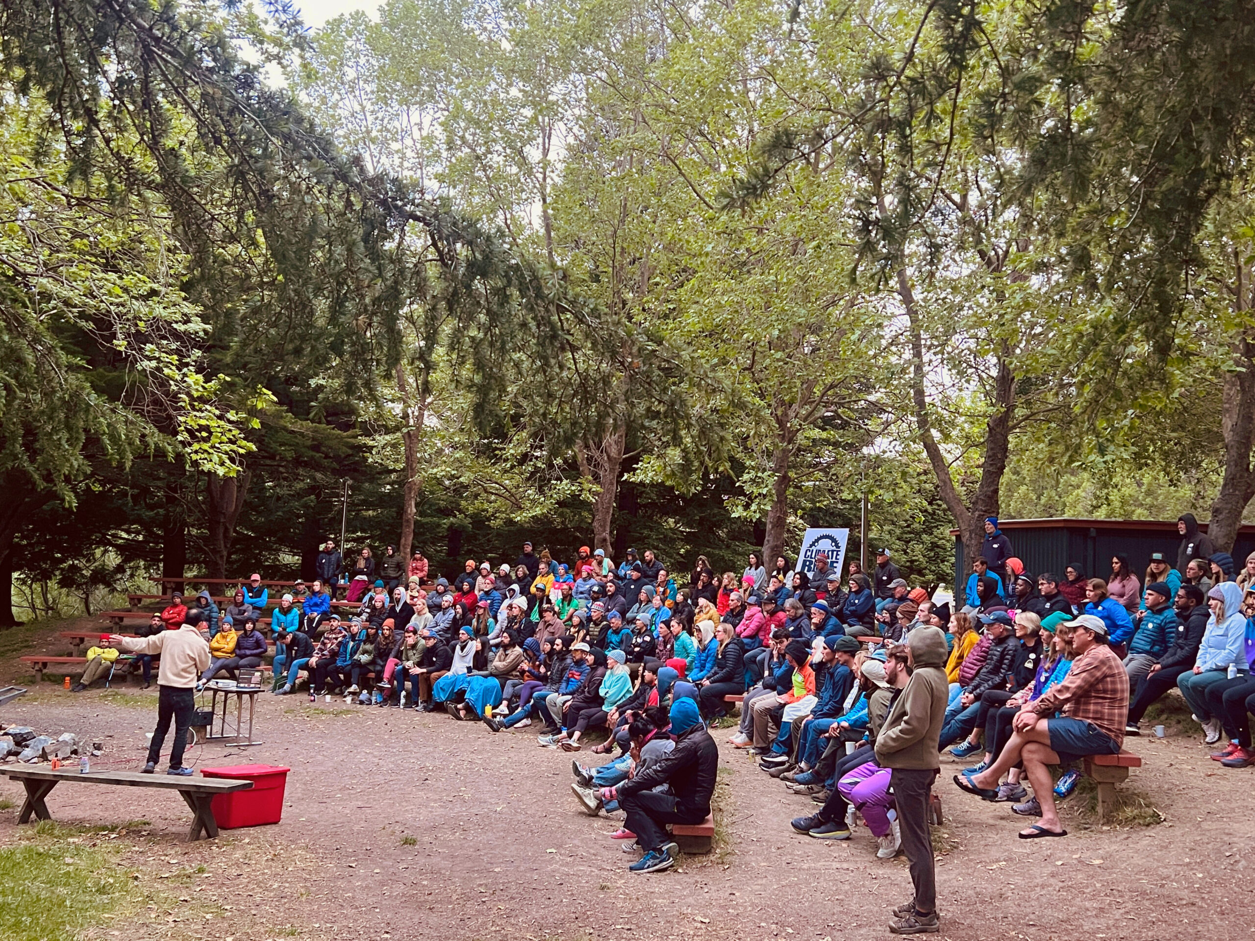 Green Fondo Riders listen to speaker at Walker Creek Ranch's beautiful outdoor amphitheater