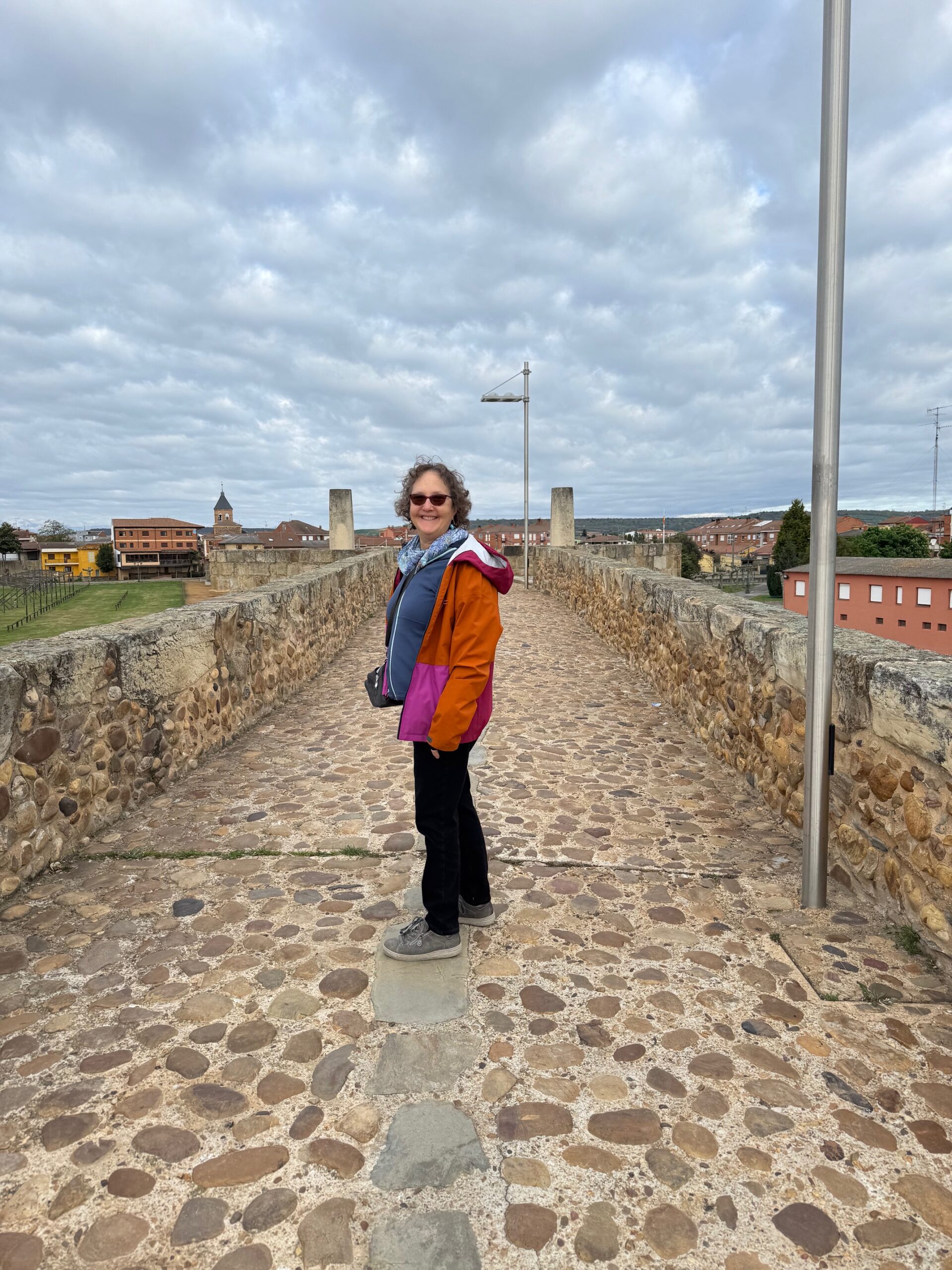 Linda Loewinger on a cobble stone path on the Camino in Spain.