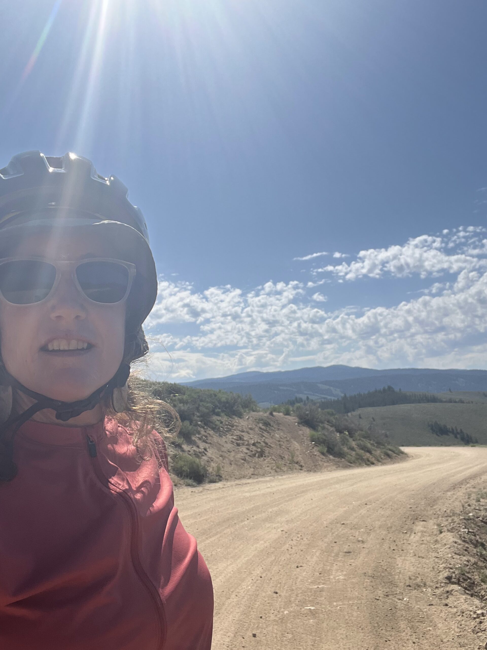 Cecily Ruttenberg on Idaho Ride looking along a gravel path.