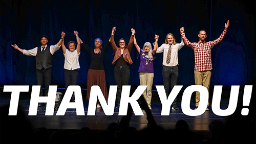 The photo features a group of storytellers holding hands aloft during a curtain call.